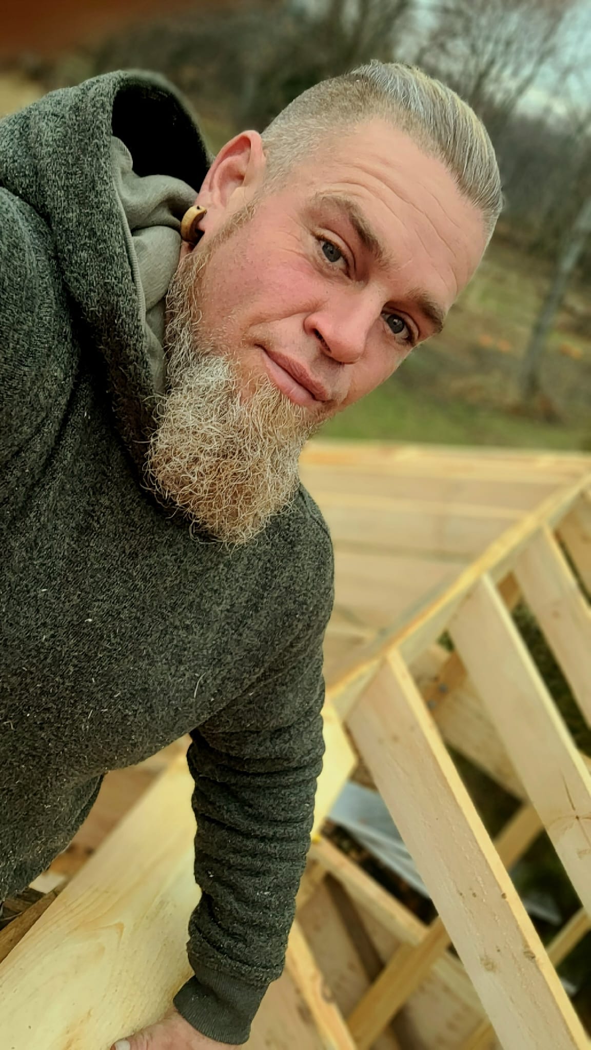 Skilled craftsman working on timber frame